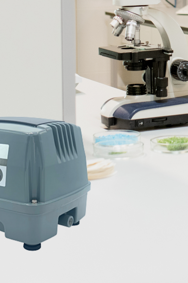 Grey Charles Austen air pump on a white counter in a laboratory setting